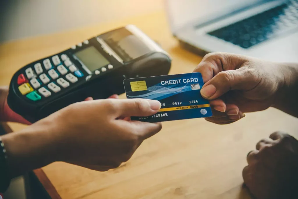 Does paying by credit card improve your credit score in the UK?